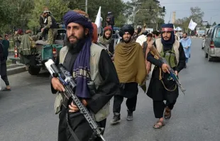 Taliban fighters gather along a street during a rally in Kabul on August 31, 2021 as they celebrate after the U.S. pulled all its troops out of the country to end a brutal 20-year war. Hoshang Hashimi/AFP via Getty Images)